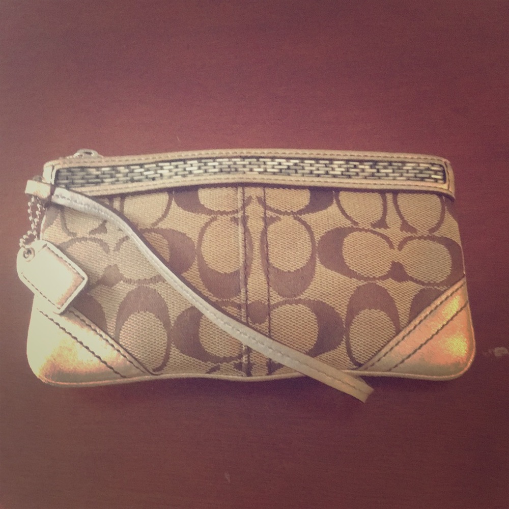 COPY - Coach signature wristlet with beaded accent.
